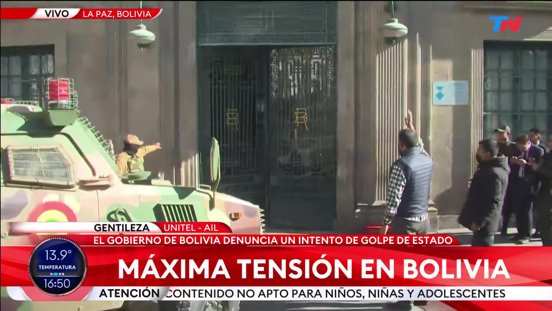 Bolivian military armoured vehicle breaks down the doors of the Palacio Quemado (former presidential residence) in La Paz and soldiers enter to secure the building